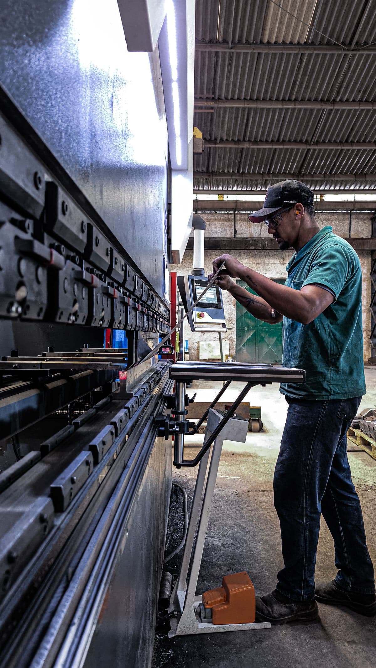 The Workers Operate the Machine Carefully